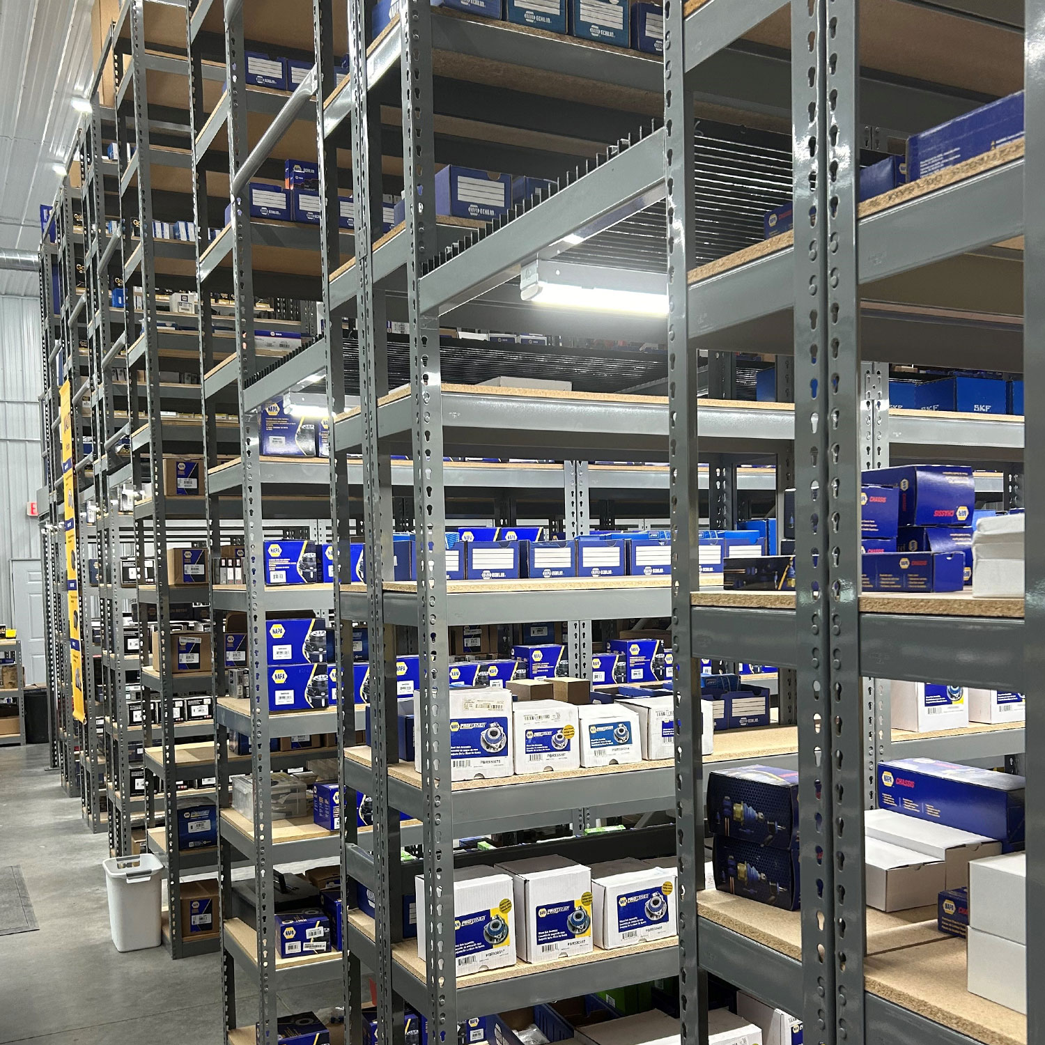 WPSS Rivetier boltless steel shelving installed with particle board back-to-back